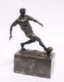 Bronze soccer player figurine