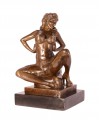 Statue of a sexy topless woman made of bronze