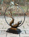 Bronze statue of a naked girl with birds