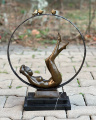 Bronze statue of a naked girl with birds