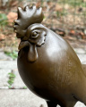Large sculpture of a rooster made of bronze