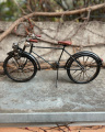 Metal model of a black bicycle bike made of sheet metal