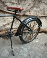 Metal model of a black bicycle bike made of sheet metal