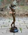 Gorgeous sculpture of a naked girl made of bronze