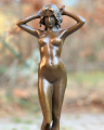 Gorgeous sculpture of a naked girl made of bronze