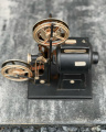 A tin model of a film projector