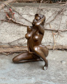 Statue of a topless girl