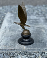 Bronze statue of an eagle on a globe - art deco figurine
