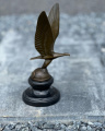 Bronze statue of an eagle on a globe - art deco figurine
