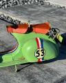 Retro model of a green scooter VESPA made of sheet metal