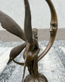 Large sculpture of the Moon Fairy on a crescent moon - modern art
