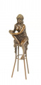 Bronze naked woman on a bar stool