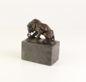 A BRONZE SCULPTURE OF A LION AND SNAKE1