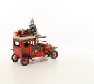 A TIN MODEL OF AN OLDTIMER CAR IN CHRISTMAS STYLE