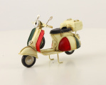 Retro model of a scooter made of sheet metal - white color