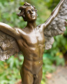a bronze statue of an angel