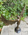 a bronze statue of an angel