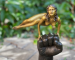 Bronze statue of a naked woman on the wrist