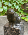 a Bronze bear figurine