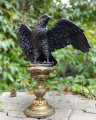 A large bronze eagle statue on a pedestal