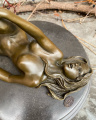 Erotic bronze figurine of a lying naked woman