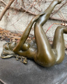 Erotic bronze figurine of a lying naked woman