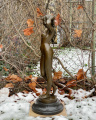Large sculpture of a naked girl made of bronze
