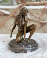 Erotic bronze figurine of a seated girl
