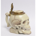 Porcelain skull with bronze decoration