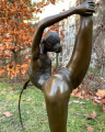 Statue of a gymnast with hoop made of bronze