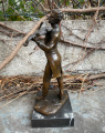 Figurine of violin player made of bronze