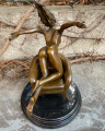 Erotic bronze statuette of a naked sexy woman on a chair