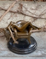 Erotic bronze statuette of a naked sexy woman on a chair