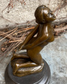 Erotic statue of a tied nude woman made of bronze