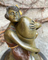 Erotic bronze statuette of a woman and a penis
