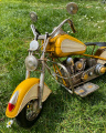 Metal model of a yellow motorcycle